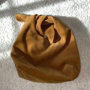 Brown clutch with tie closure